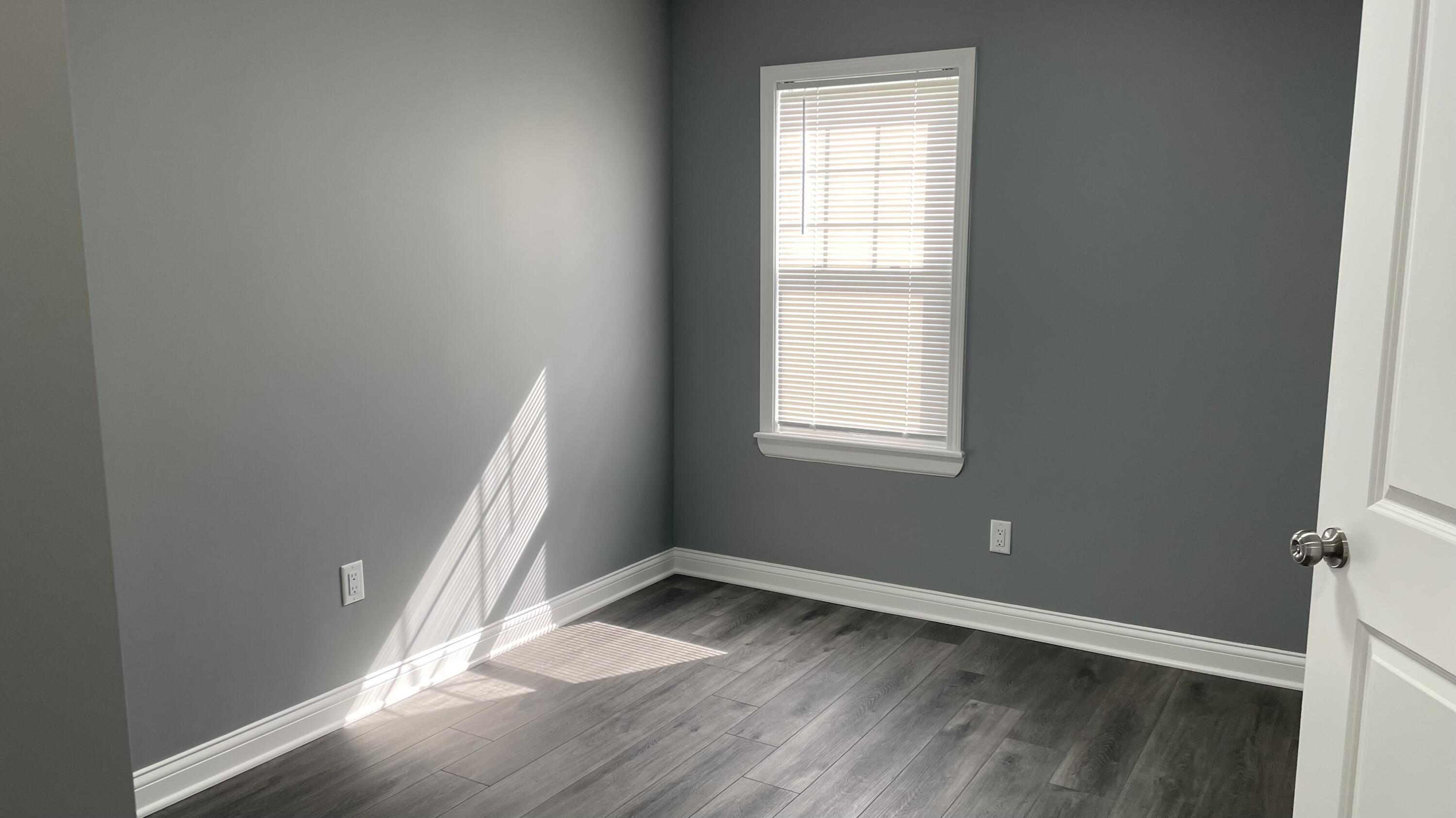 3362 Virginia Street Gary, IN 46409 - Photo 18 of 29 an empty room with wooden floor and windows