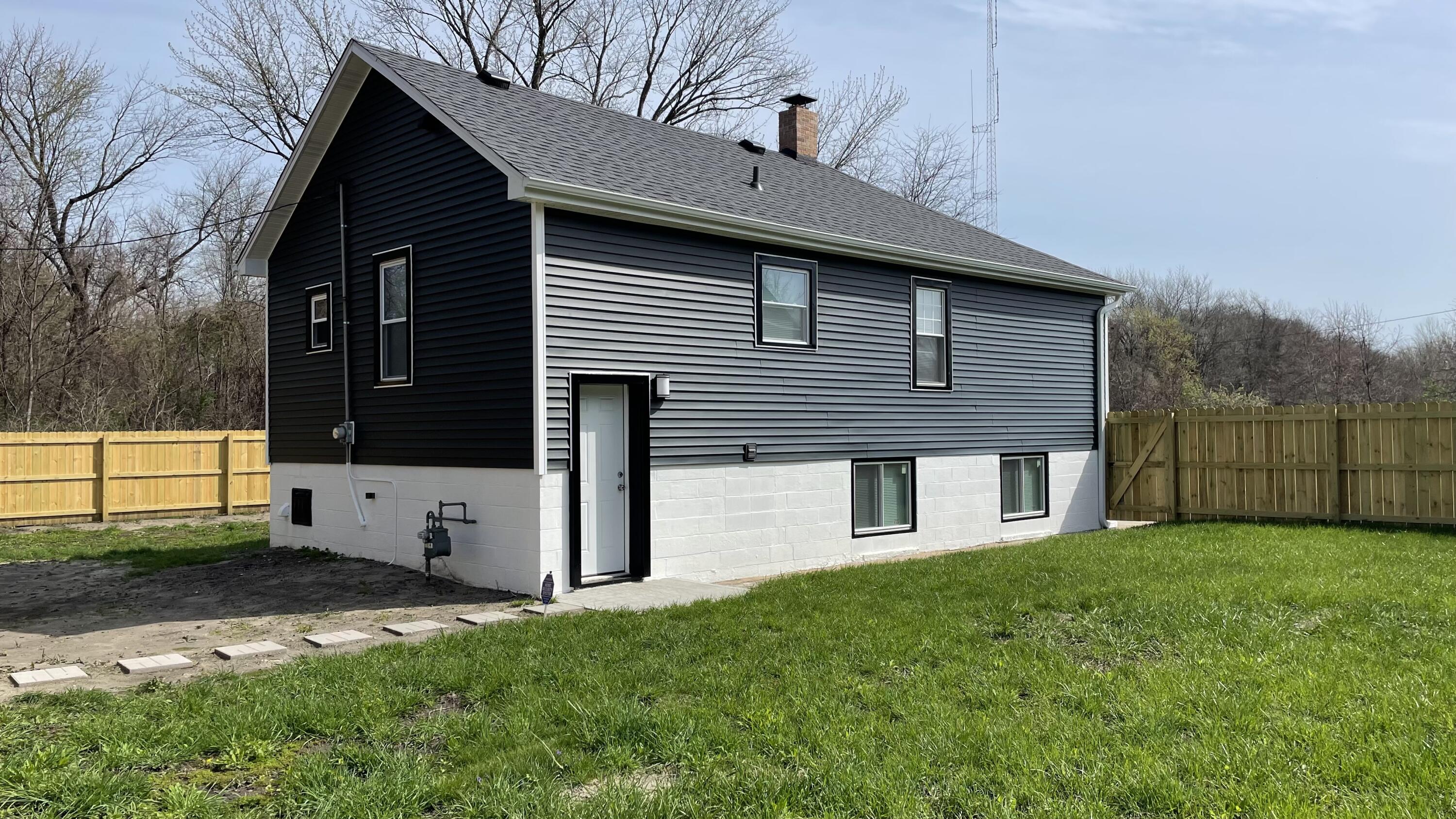 3362 Virginia Street Gary, IN 46409 - Photo 28 of 29 a front view of a house with a yard
