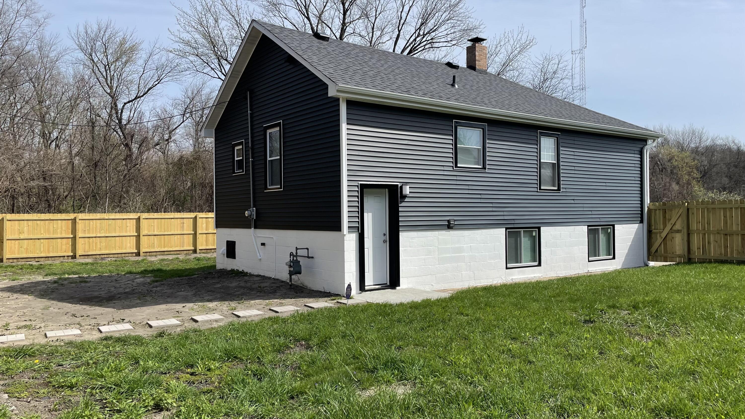 3362 Virginia Street Gary, IN 46409 - Photo 29 of 29 a front view of a house with a yard