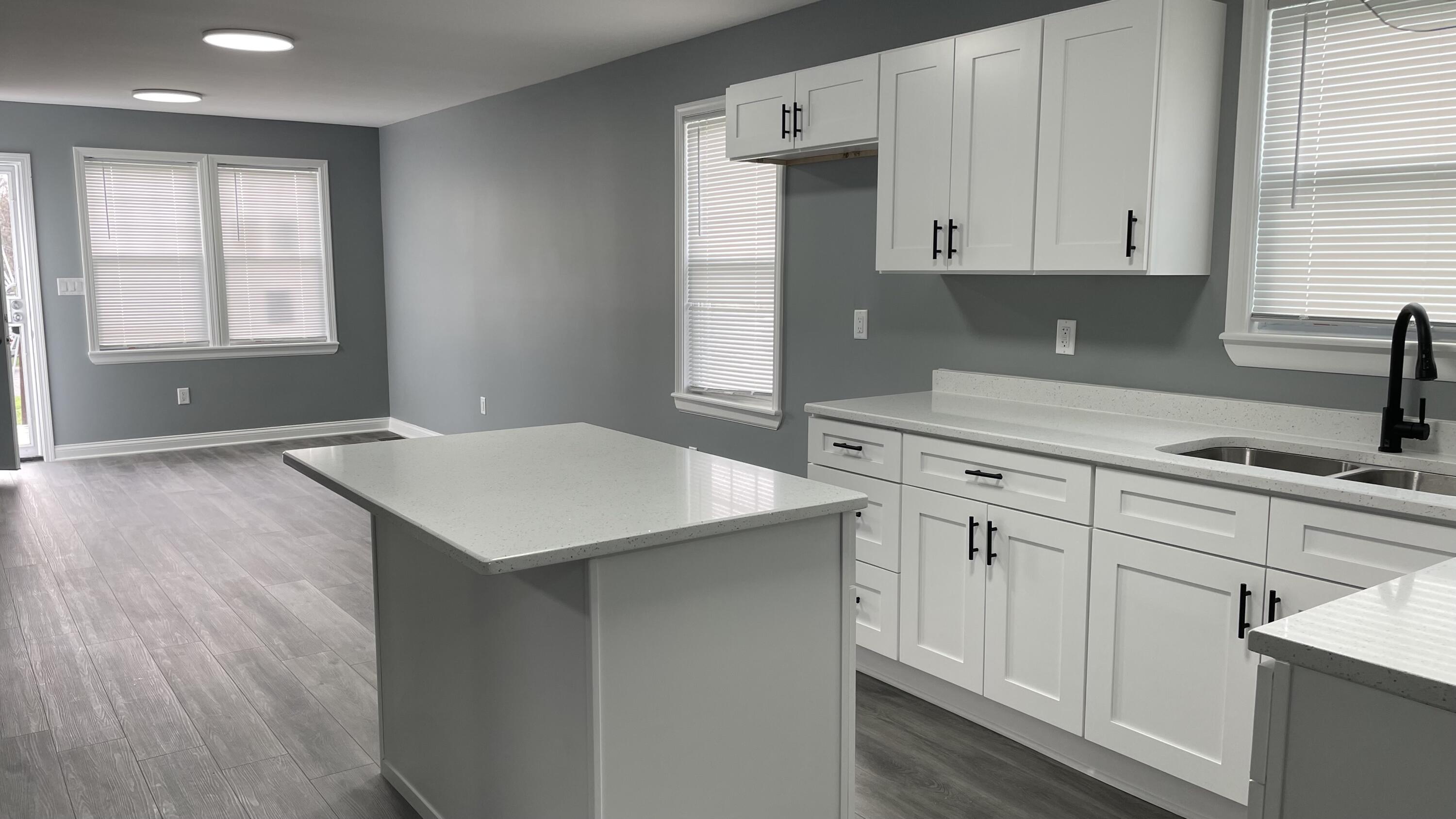 3362 Virginia Street Gary, IN 46409 - Photo 6 of 29 a kitchen with white cabinets and sink