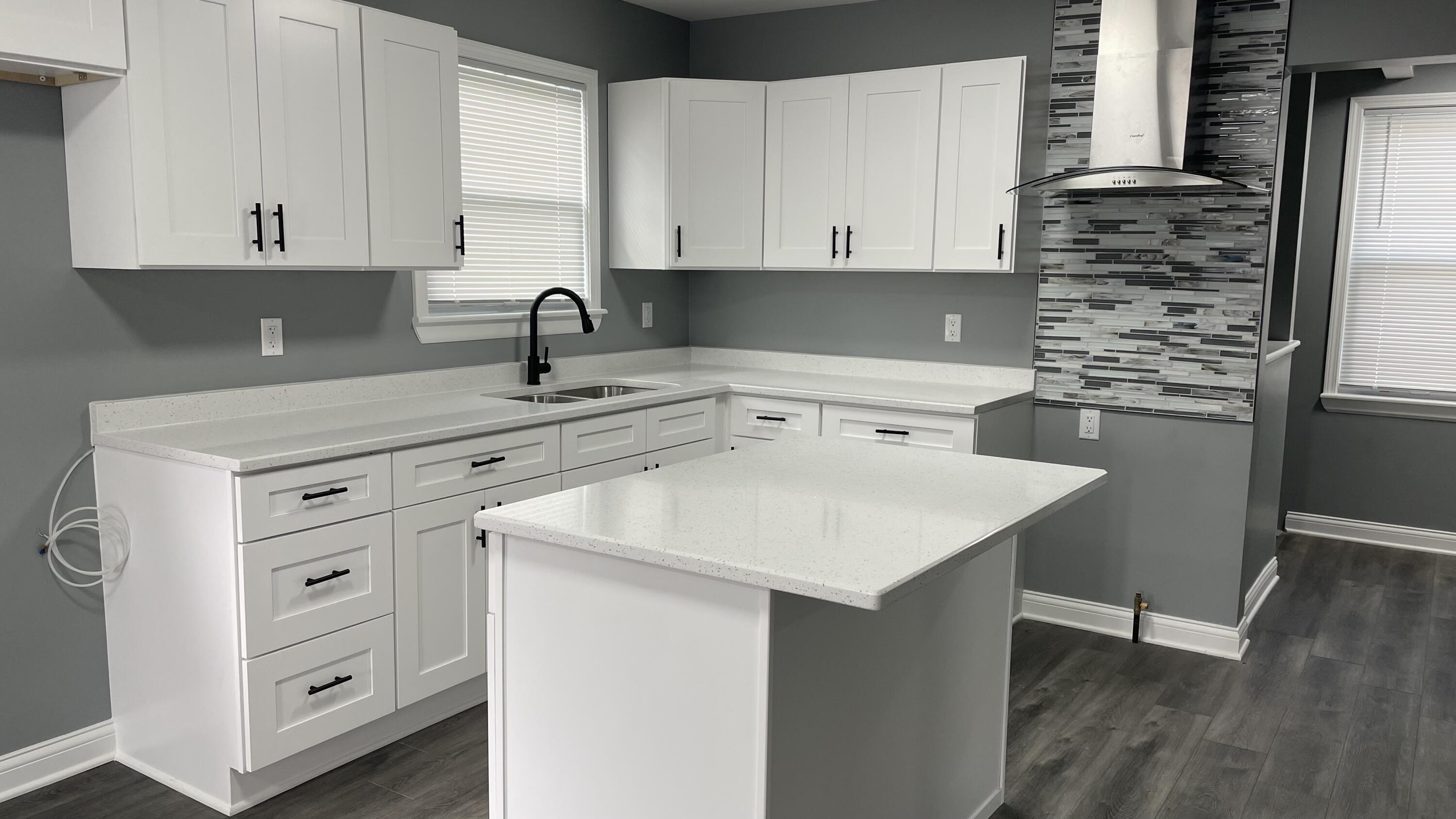 3362 Virginia Street Gary, IN 46409 - Photo 8 of 29 a kitchen with cabinets appliances a sink and dishwasher