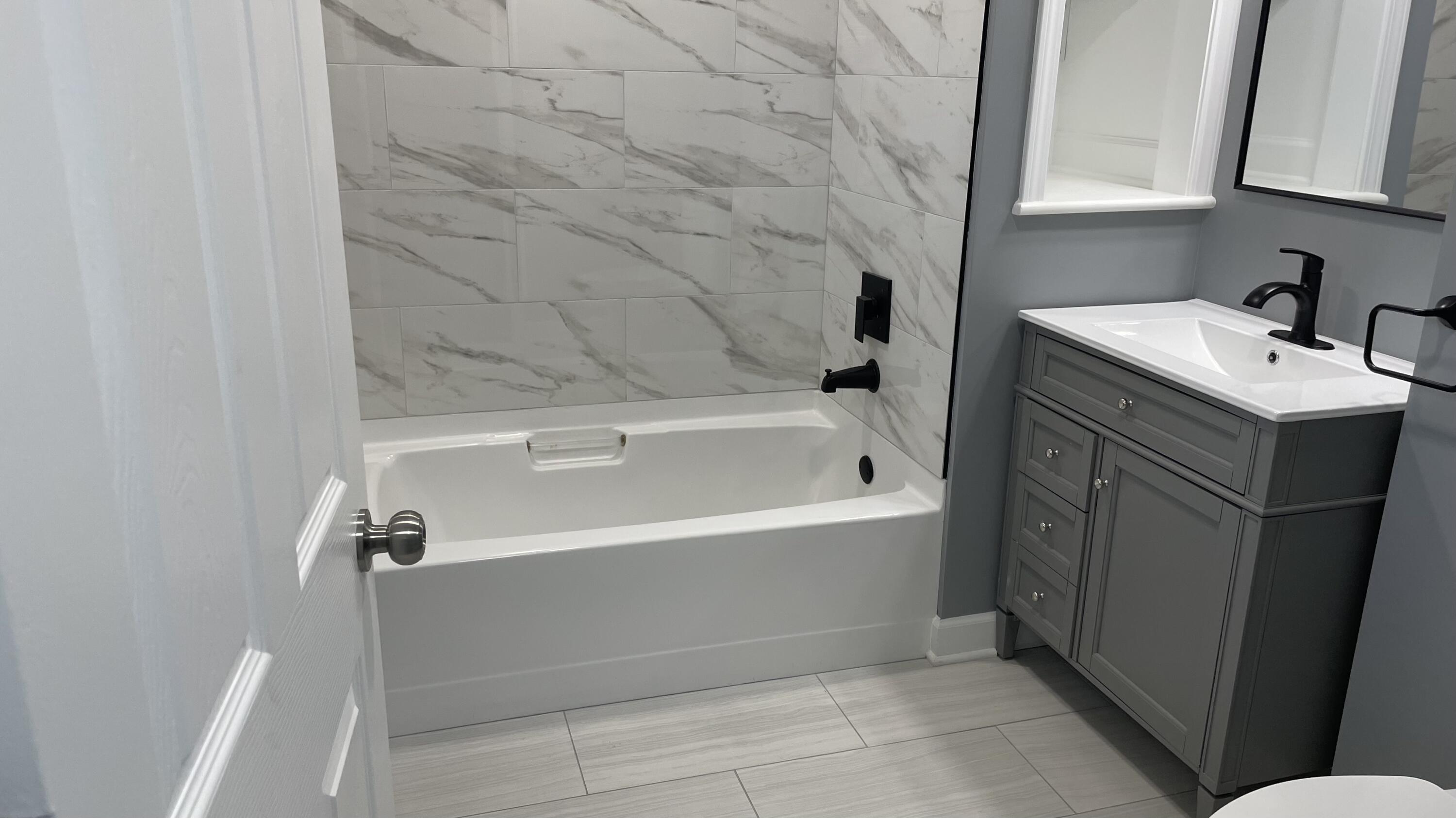 3362 Virginia Street Gary, IN 46409 - Photo 10 of 29 a bathroom with a sink and bathtub