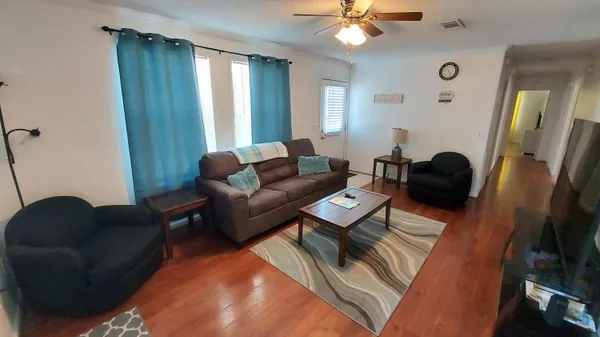 a living room with furniture and a window