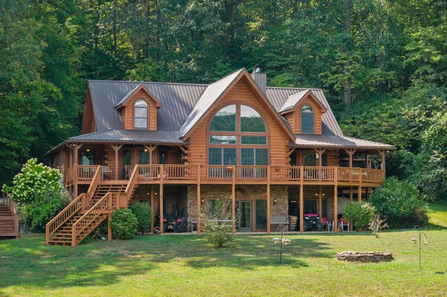 a view of a green field with lots of bushes