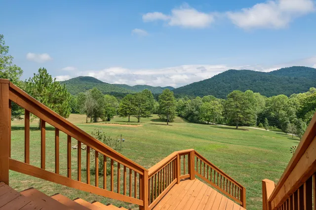 a living room with furniture fireplace and flat screen tv