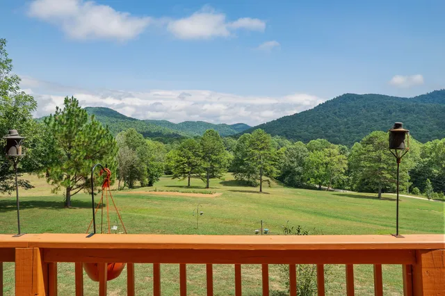 a living room with fireplace furniture and a flat screen tv