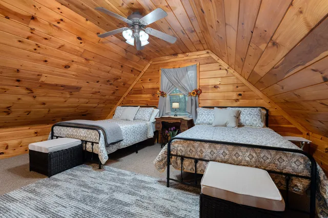 a bedroom with furniture and wooden floor