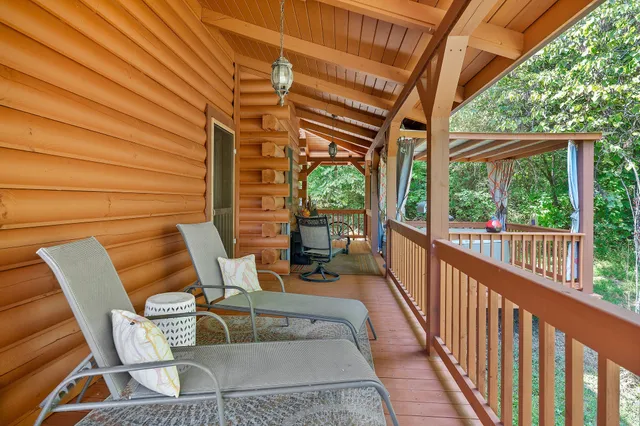 a outdoor dining space with lots of furniture and appliances