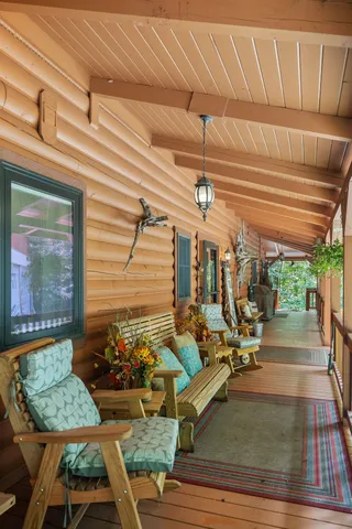 a bed room with furniture and a flat screen tv