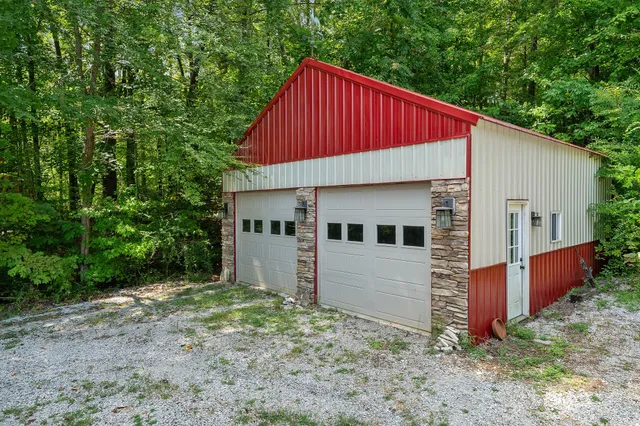 a spacious bathroom with a double vanity sink a mirror and a bathtub