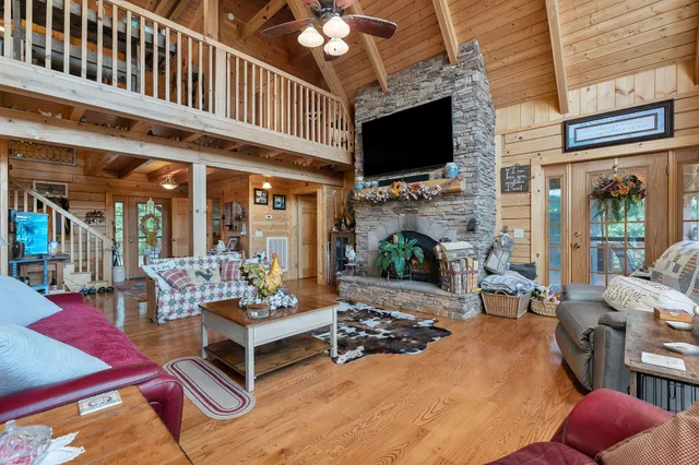 a living room with a couch and a chandelier