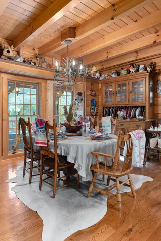 a living room with lots of furniture and clutter