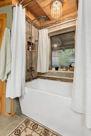 a view of a green field with an trees