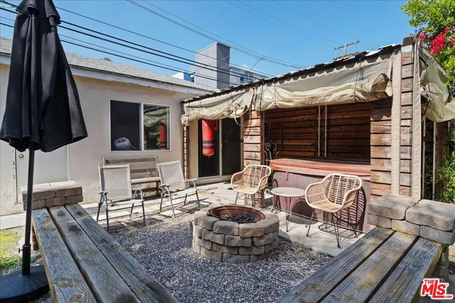 a outdoor space with patio the couches and a dining table with chairs