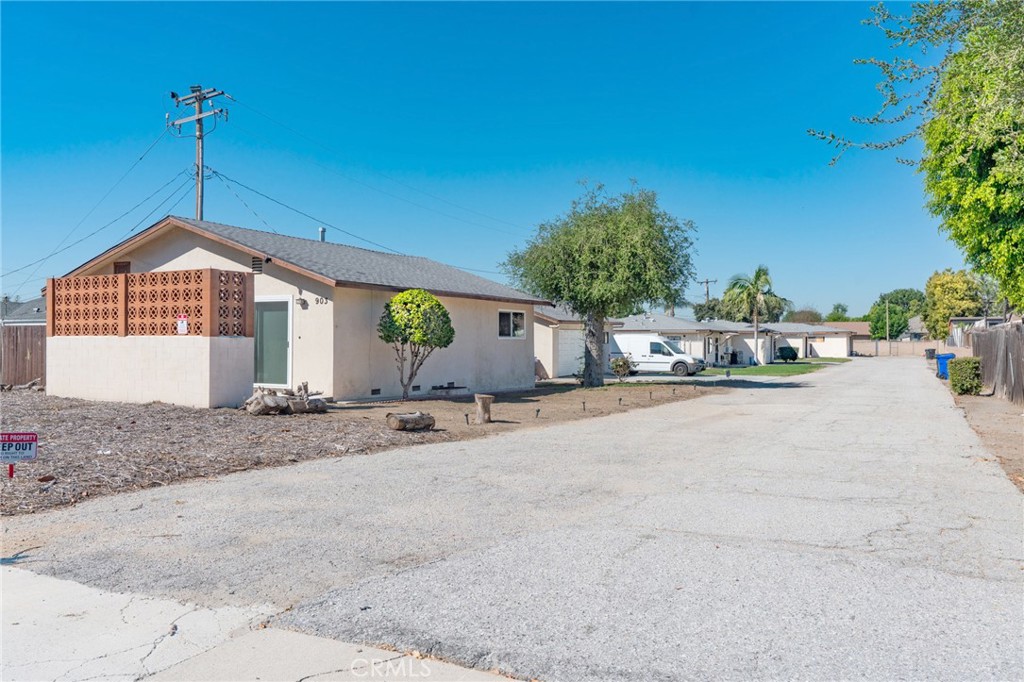 a view of a house with a outdoor space and street view