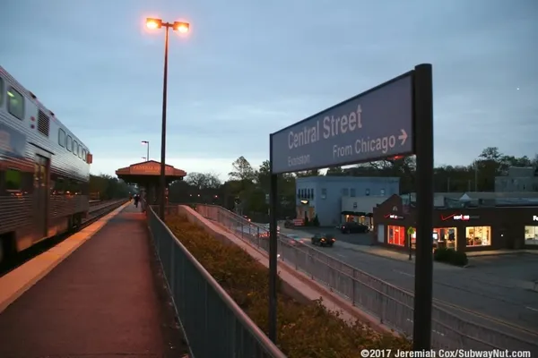a view of a cars park in front of a building
