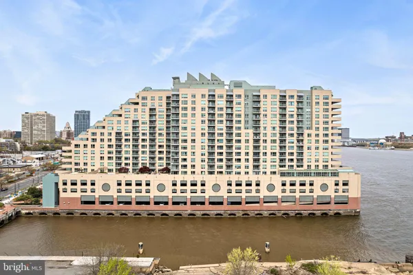 a view of a large body of water with a building in the background