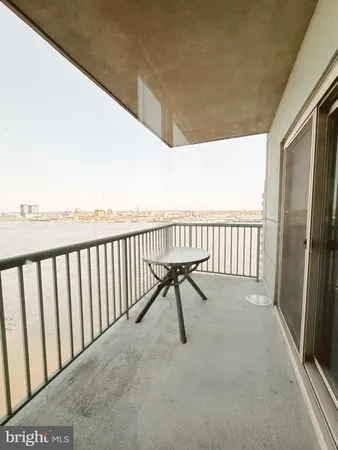a view of balcony with furniture
