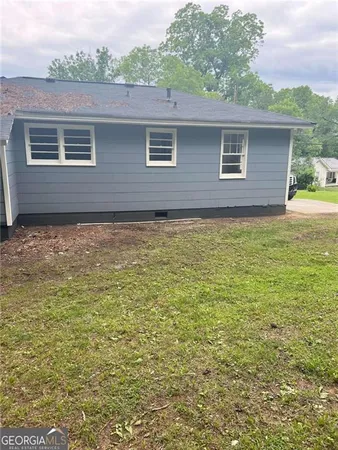 a view of a house with a yard from a ceiling window