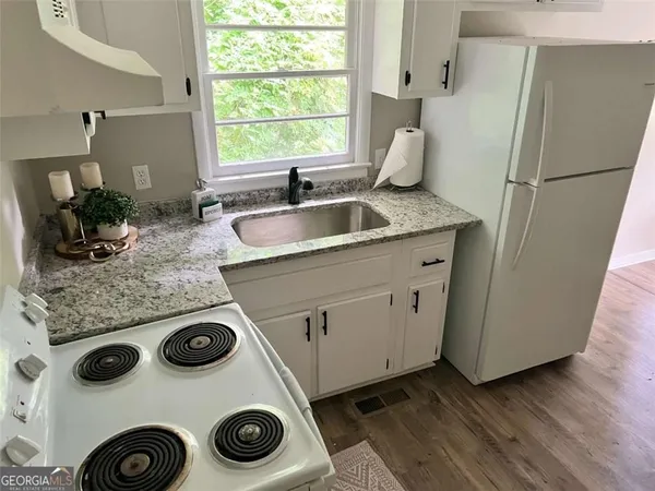 a kitchen with a stove and a sink