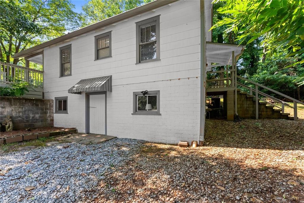 168 West Main Street Dahlonega, GA 30533 - Photo 103 of 118 a front view of a house with a yard and garage