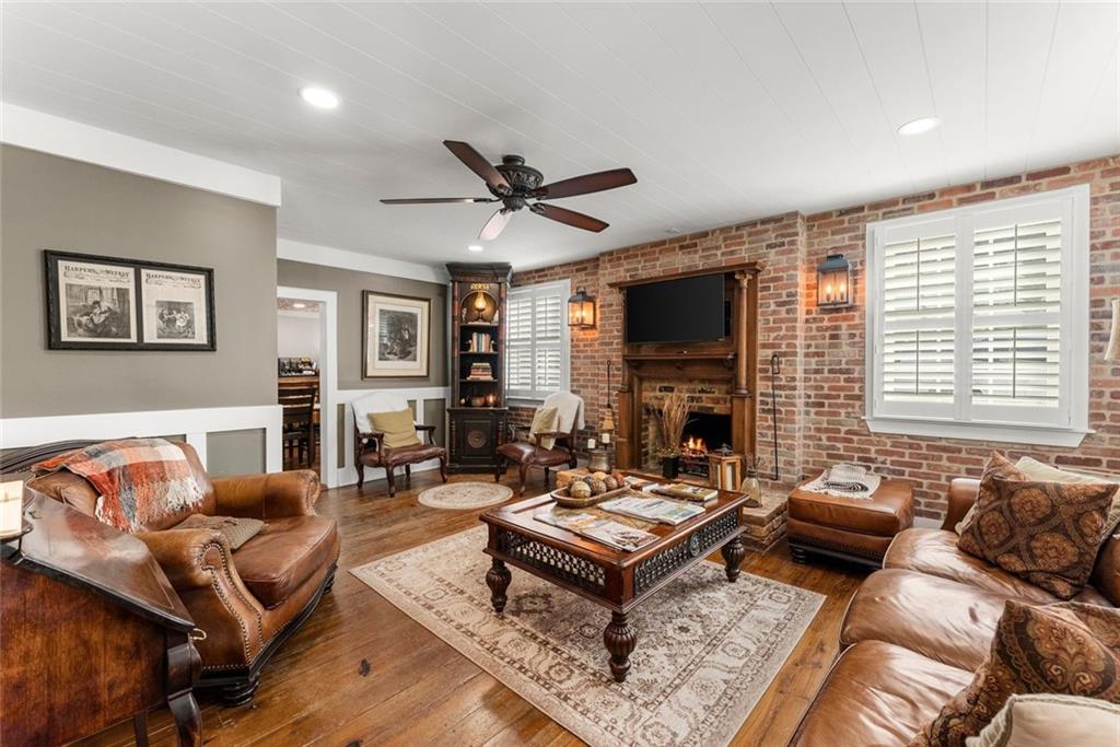 168 West Main Street Dahlonega, GA 30533 - Photo 14 of 118 a living room with furniture a fireplace and a large window