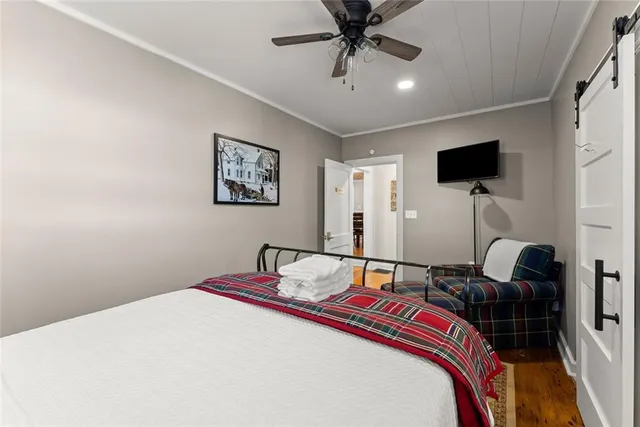 a view of a house with a big yard and large trees