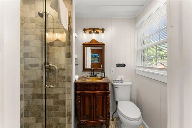 an aerial view of a residential houses with outdoor space