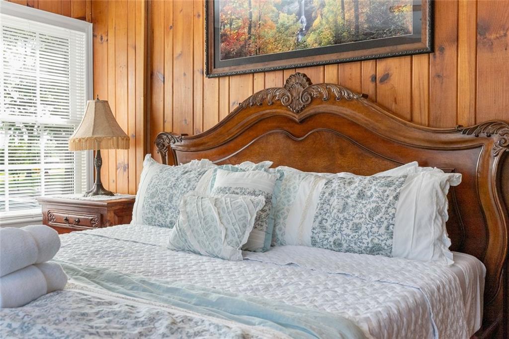 168 West Main Street Dahlonega, GA 30533 - Photo 65 of 118 a bedroom with a bed and wooden floor