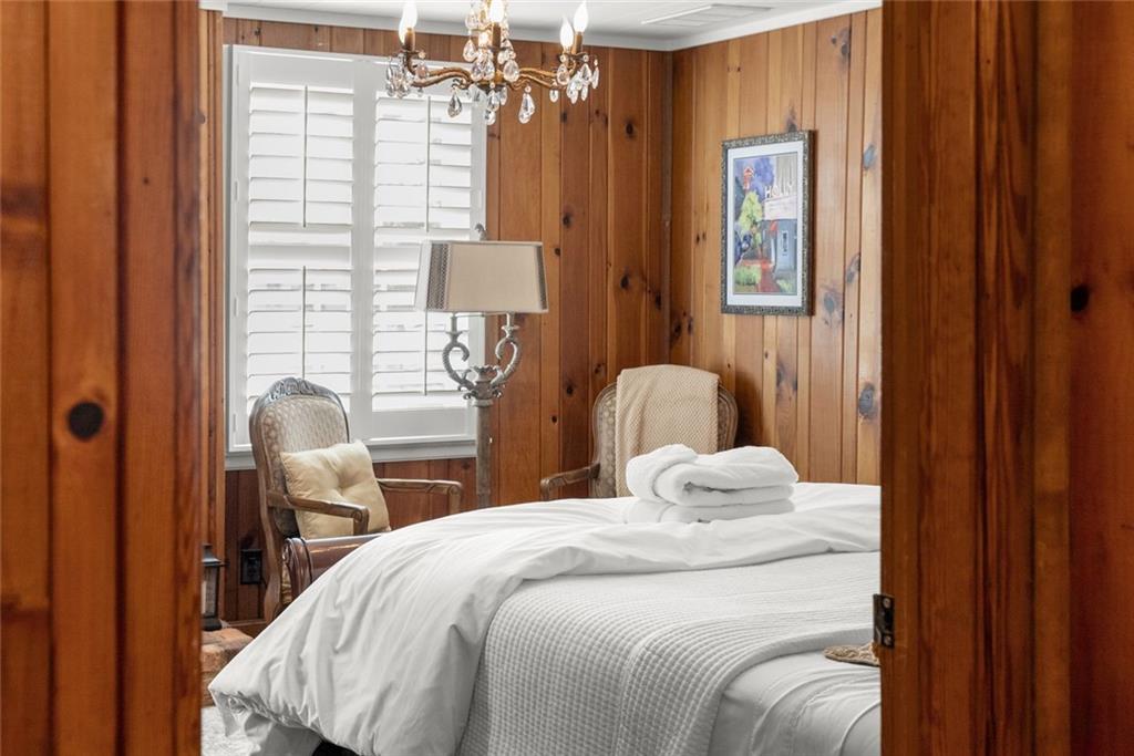 168 West Main Street Dahlonega, GA 30533 - Photo 66 of 118 a bedroom with a bed and wooden floor