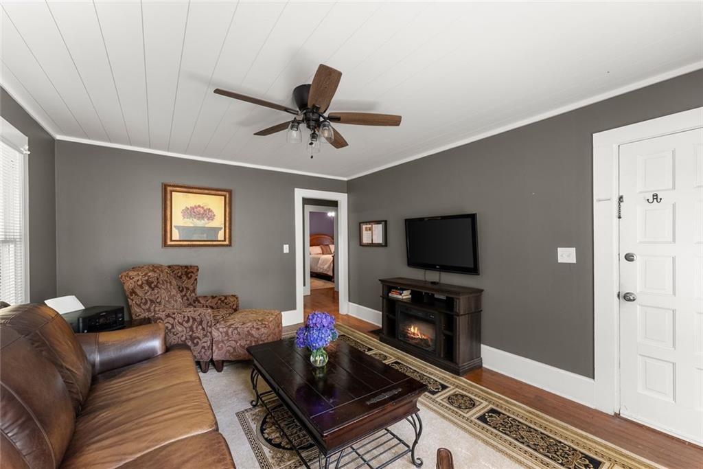 168 West Main Street Dahlonega, GA 30533 - Photo 93 of 118 a living room with furniture and a flat screen tv