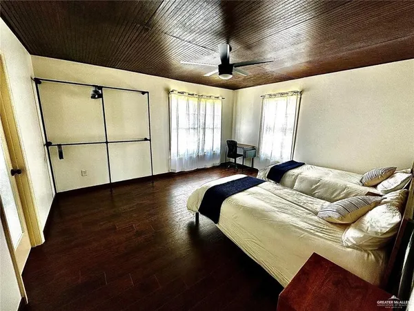 a bedroom with bed and window