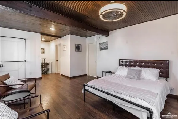 a bedroom with a bed and a cabinets