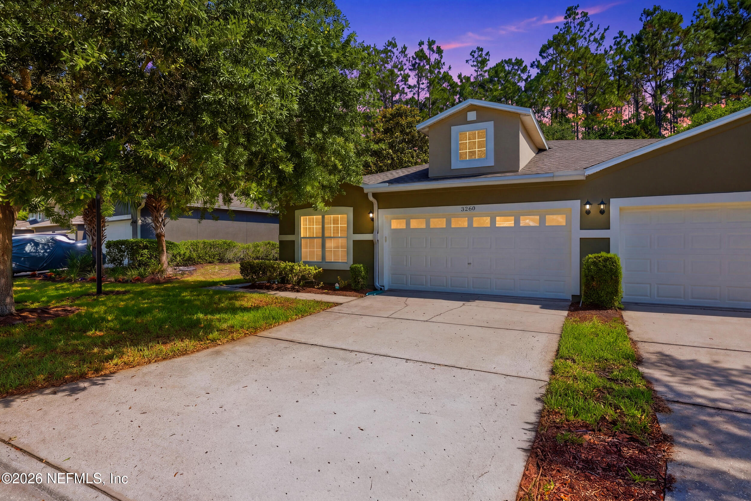 3260 Chestnut Ridge Way Orange Park, FL 32065 - Photo 1 of 39 a front view of a house with a yard and a garage