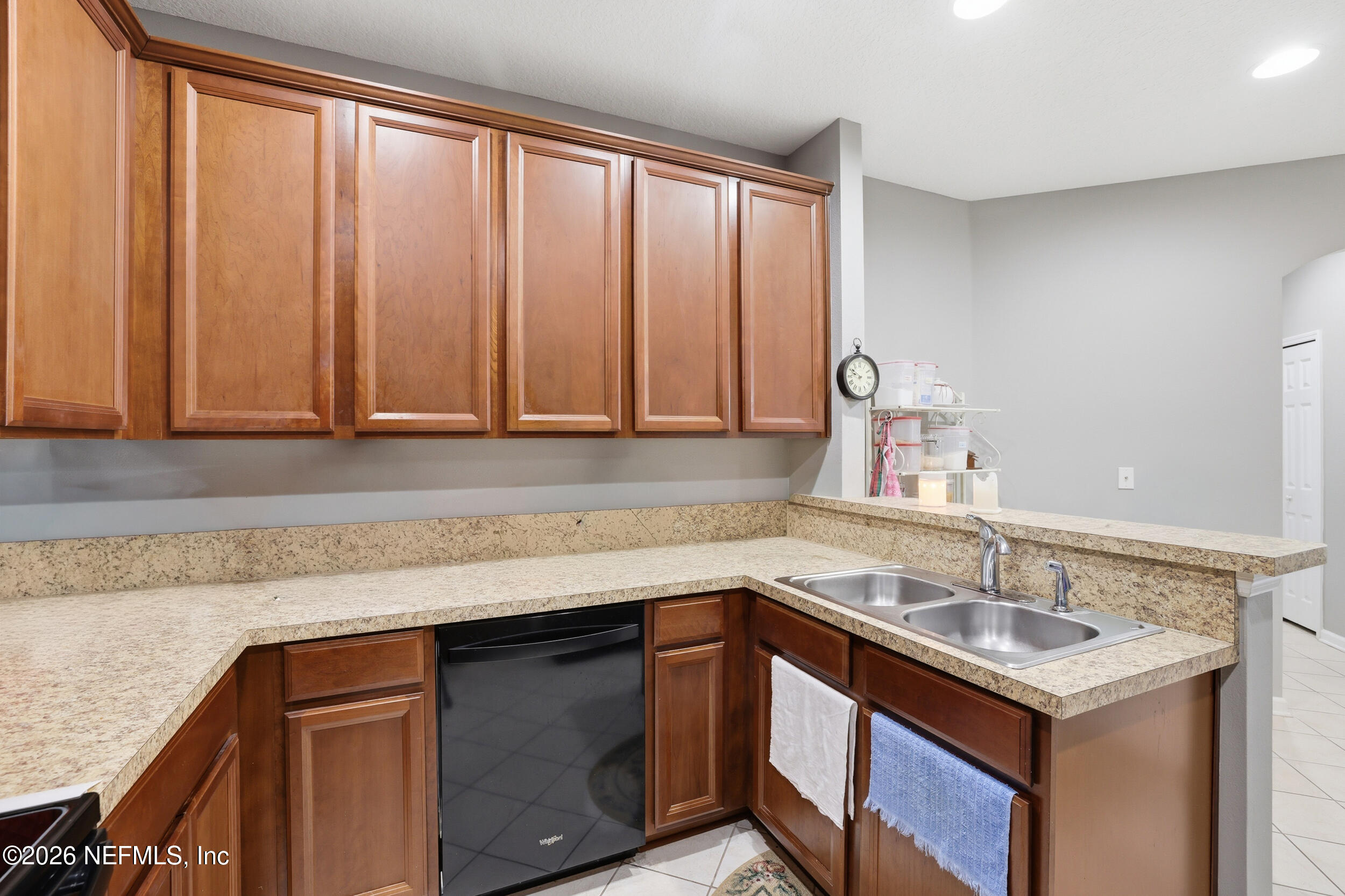 3260 Chestnut Ridge Way Orange Park, FL 32065 - Photo 11 of 39 a kitchen with a sink cabinets and a window