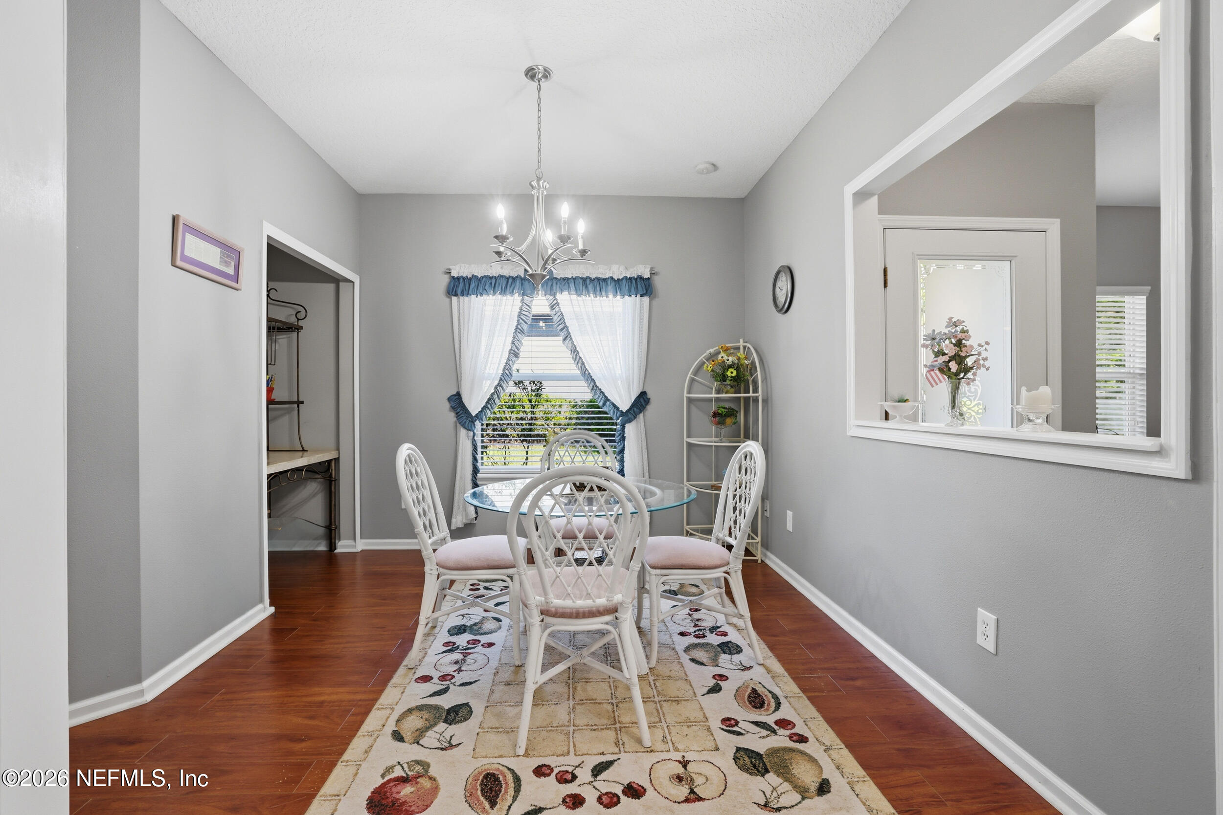 3260 Chestnut Ridge Way Orange Park, FL 32065 - Photo 12 of 39 a view of a dining room with furniture a rug and wooden floor