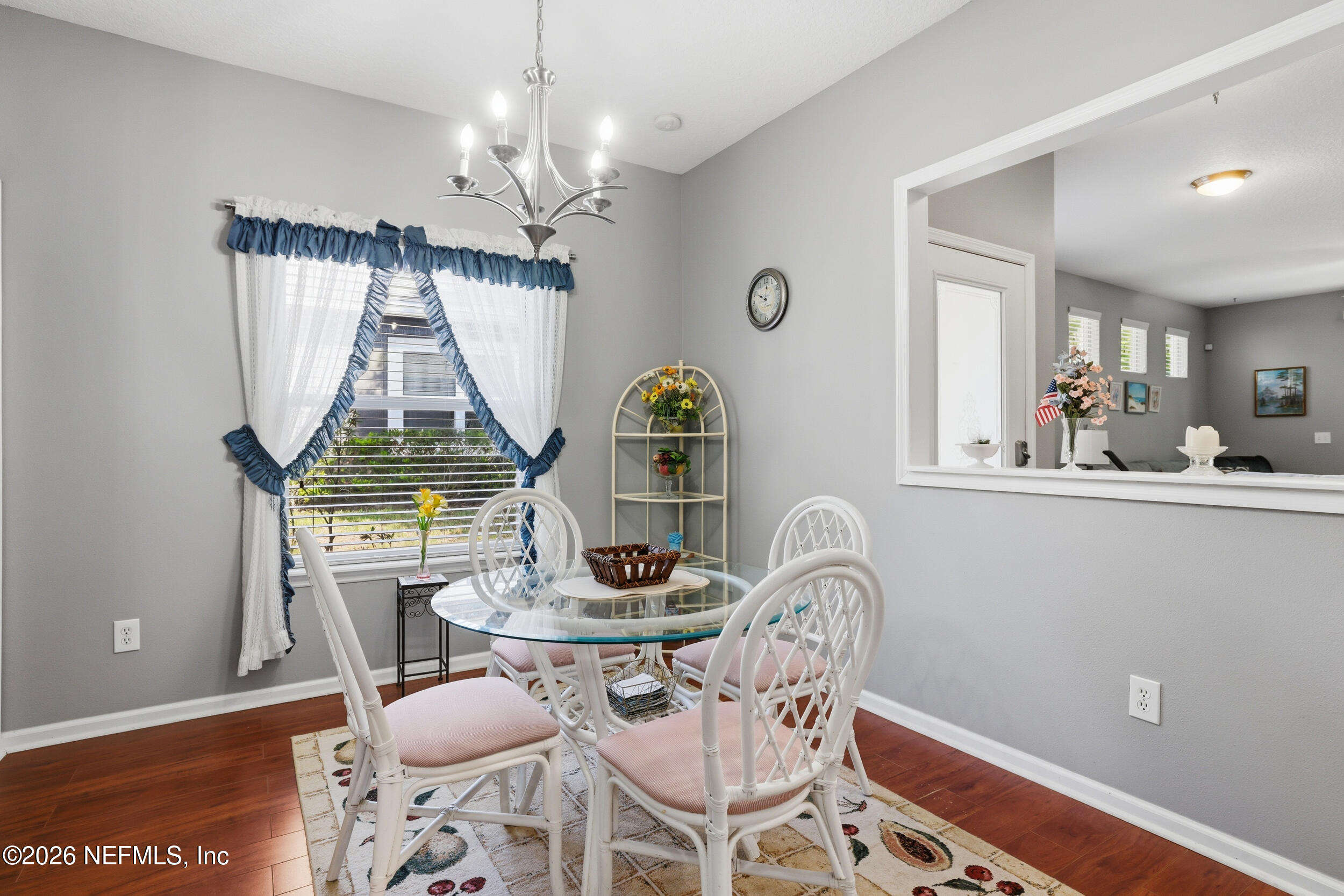 3260 Chestnut Ridge Way Orange Park, FL 32065 - Photo 13 of 39 a view of a dining room with furniture and chandelier