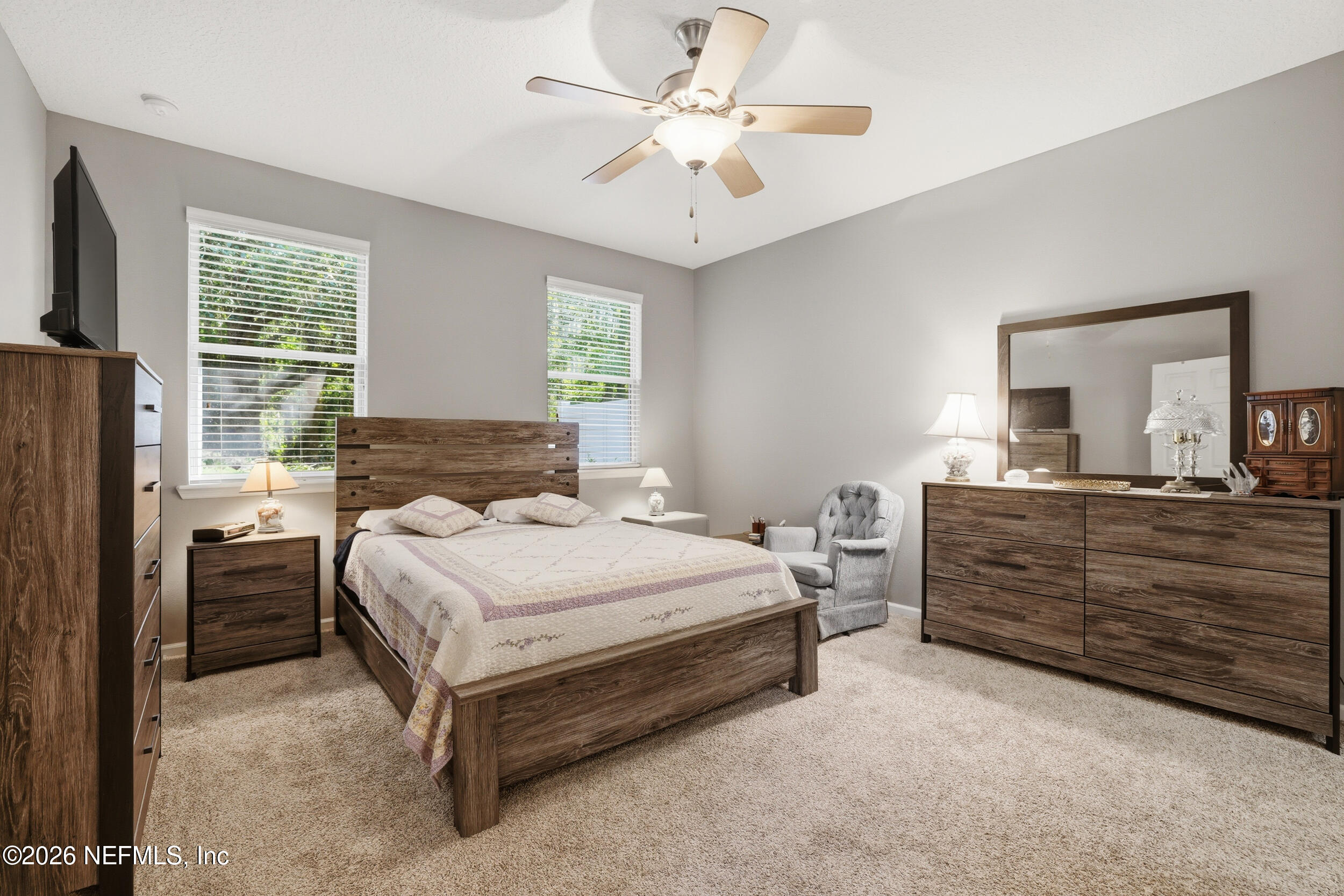 3260 Chestnut Ridge Way Orange Park, FL 32065 - Photo 17 of 39 a bedroom with a bed dresser and a window