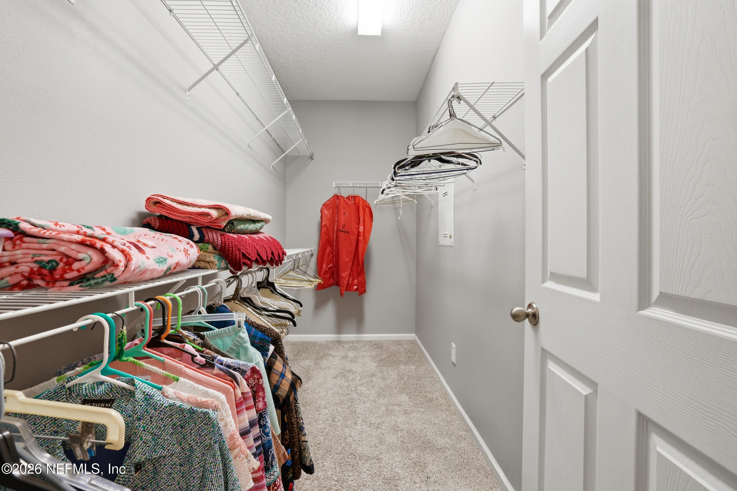 3260 Chestnut Ridge Way Orange Park, FL 32065 - Photo 19 of 39 a view of walk in closet with clothes