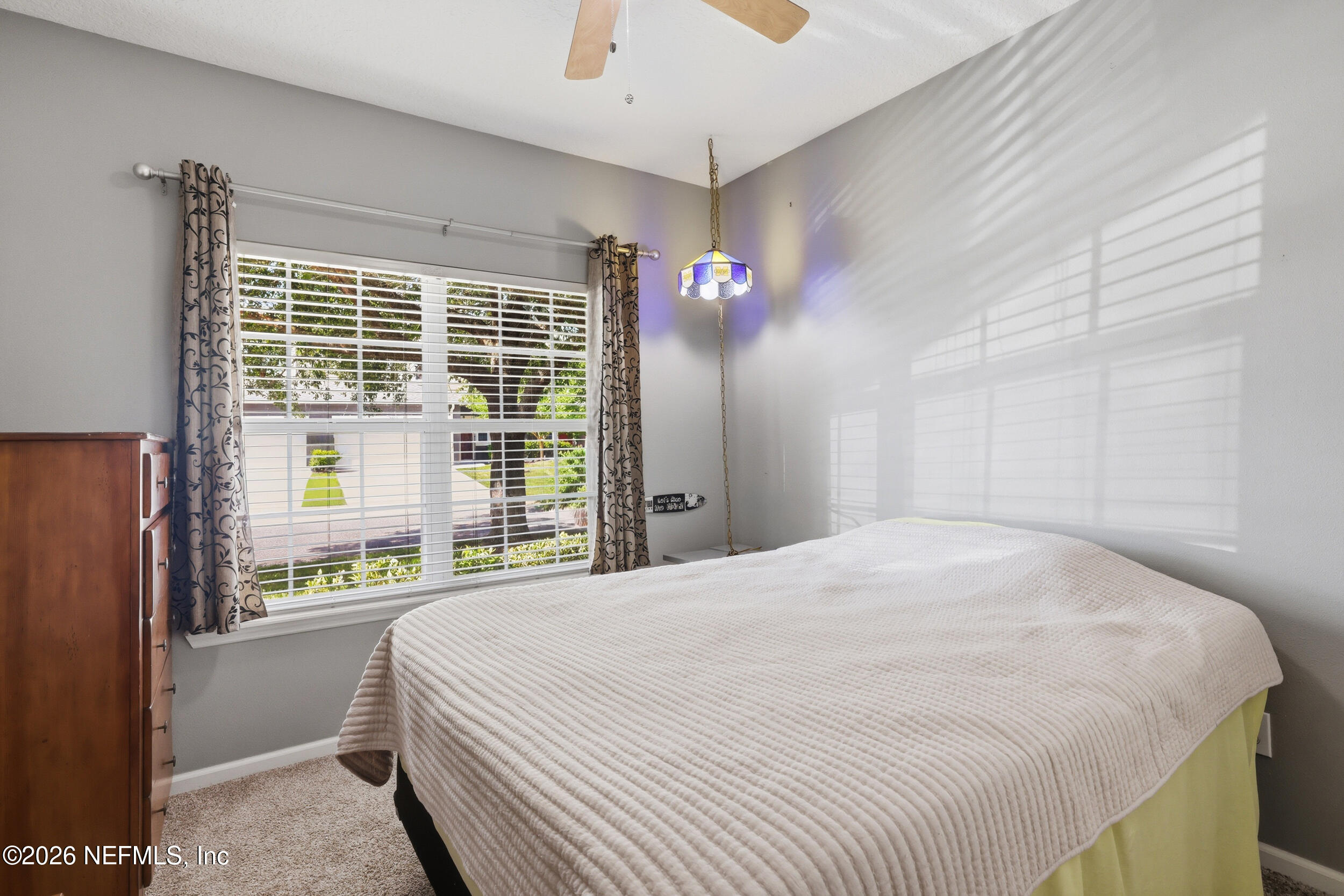 3260 Chestnut Ridge Way Orange Park, FL 32065 - Photo 21 of 39 a bedroom with a bed and a large window