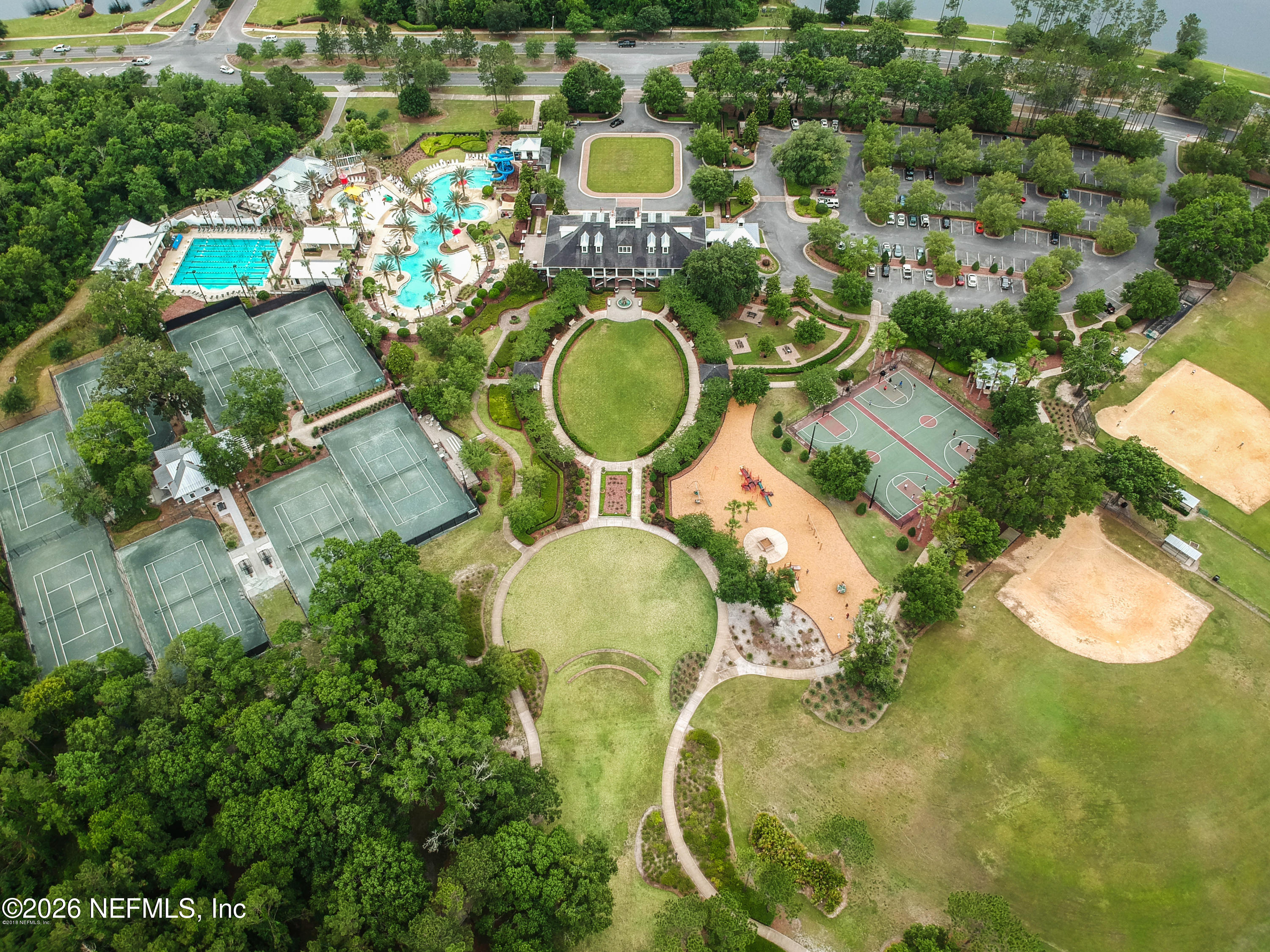 3260 Chestnut Ridge Way Orange Park, FL 32065 - Photo 39 of 39 an aerial view of a swimming pool with outdoor seating and yard