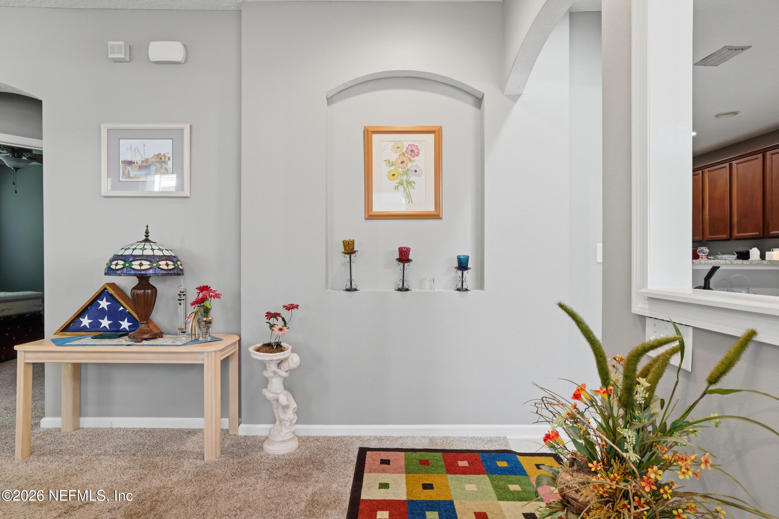 3260 Chestnut Ridge Way Orange Park, FL 32065 - Photo 7 of 39 a bedroom with furniture and a fireplace