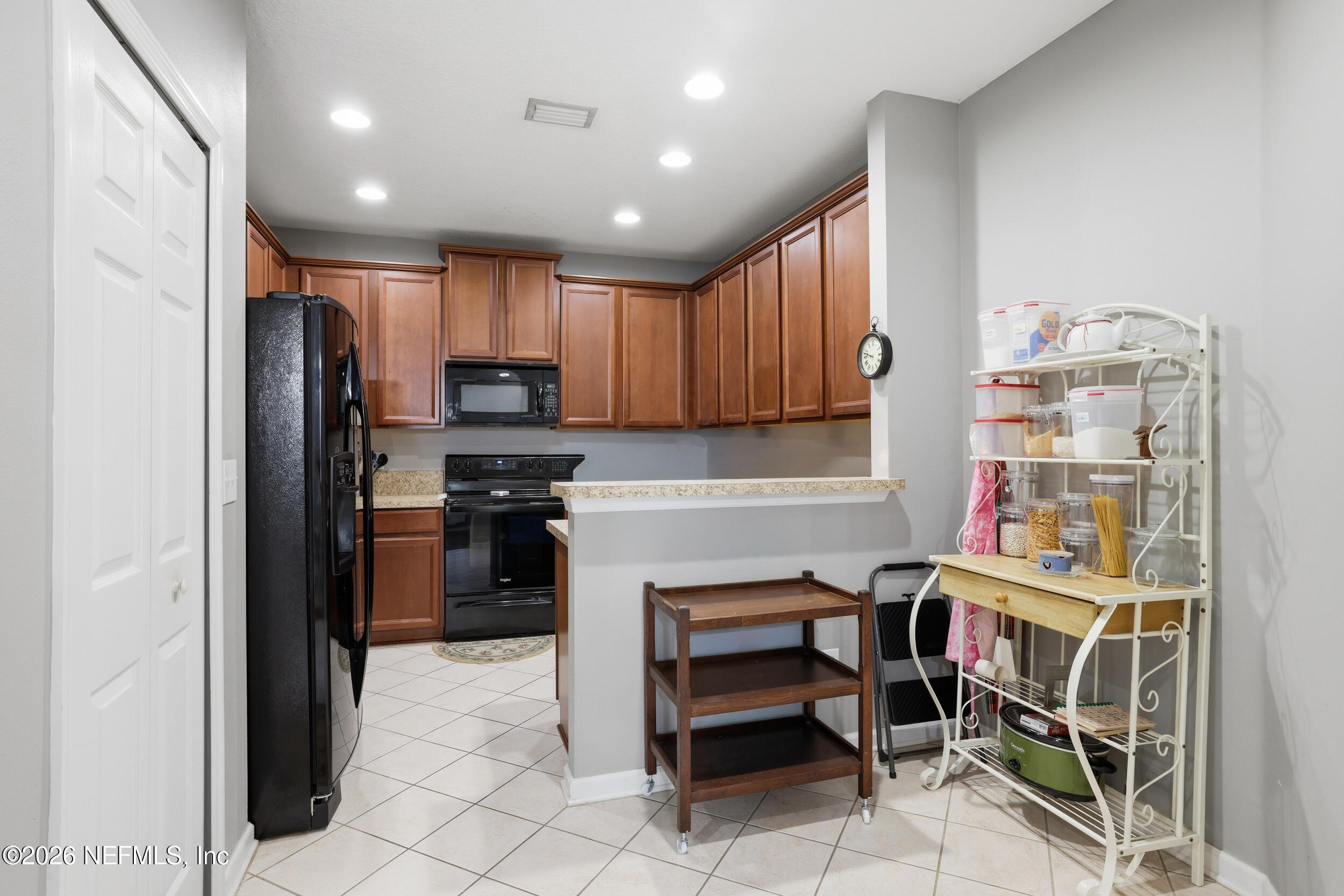 3260 Chestnut Ridge Way Orange Park, FL 32065 - Photo 8 of 39 a kitchen with stainless steel appliances granite countertop a refrigerator and a stove top oven