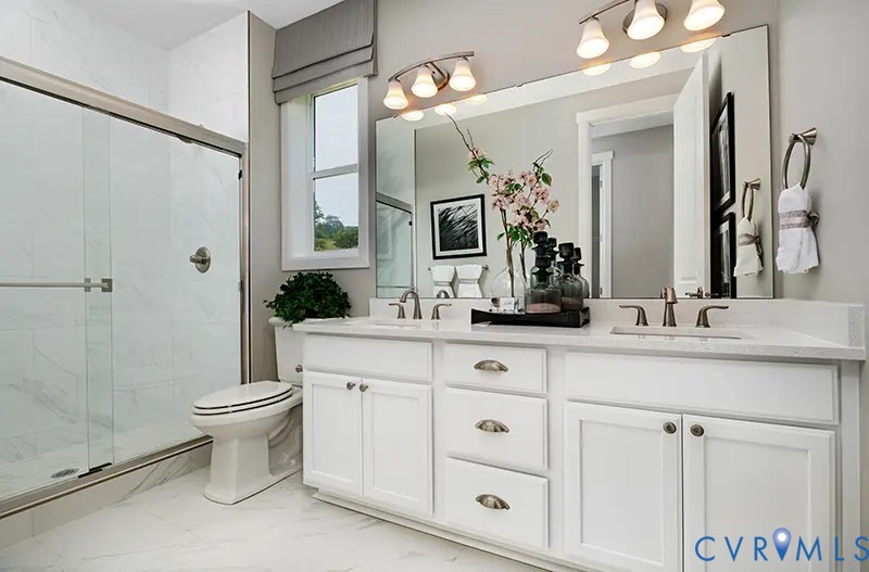 304 Kennington Road Aylett, VA 23009 - Photo 6 of 6 a bathroom with a double vanity sink mirror and toilet