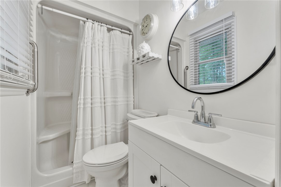 4416 Denver Cove Road Anderson, SC 29625 - Photo 14 of 31 A well-appointed bathroom features a bright vanity and a convenient shower-tub combination.