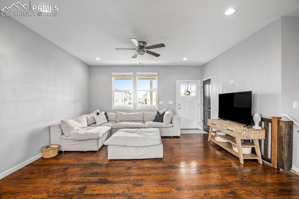 293 3rd Avenue Deer Trail, CO 80105 - Photo 3 of 28 a living room with furniture and a flat screen tv