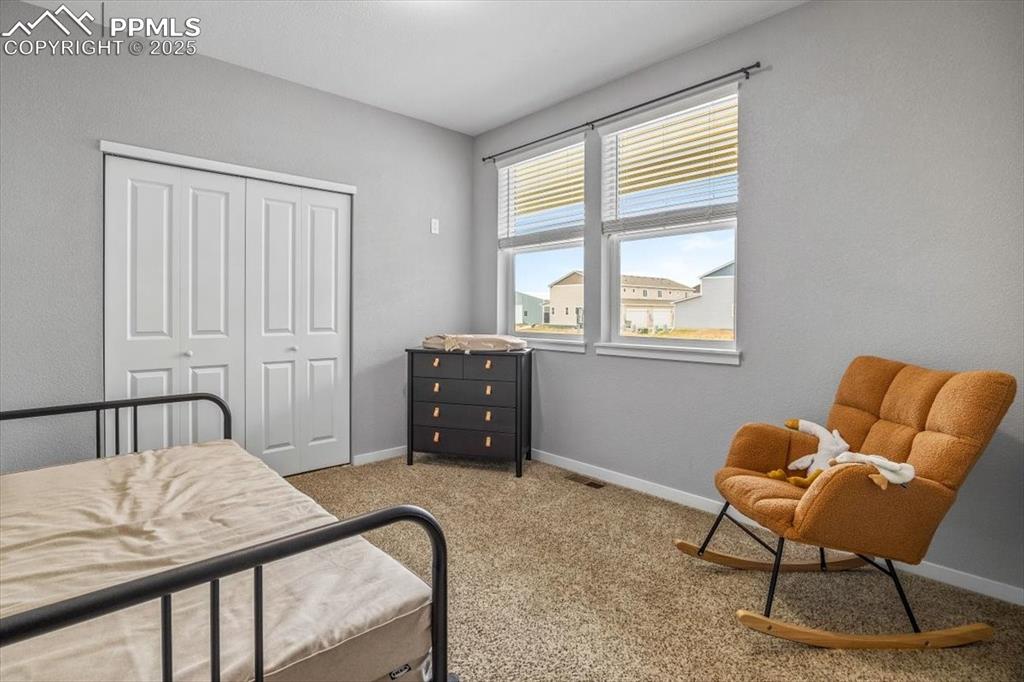 293 3rd Avenue Deer Trail, CO 80105 - Photo 10 of 28 a bedroom with furniture and a window