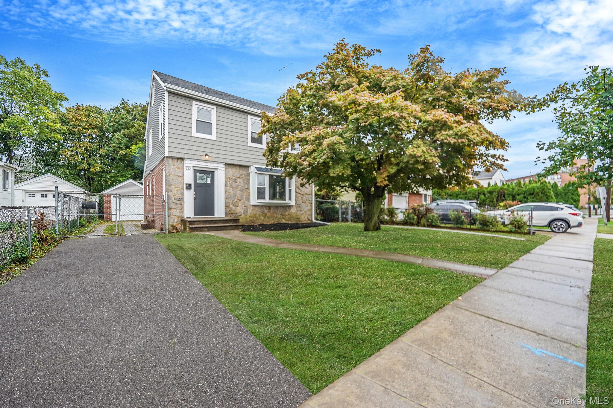 132 Duncan Road Hempstead, NY 11550 - Photo 2 of 21 a front view of a house with a yard