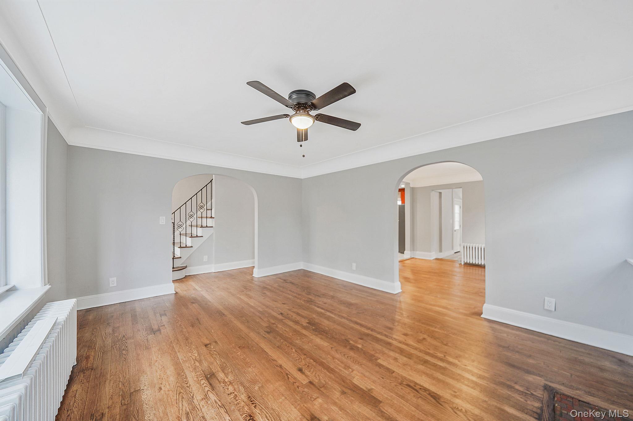 132 Duncan Road Hempstead, NY 11550 - Photo 9 of 21 wooden floor in an empty room with a window