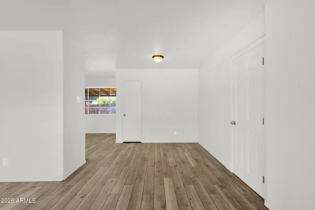 a kitchen with a refrigerator and a stove top oven